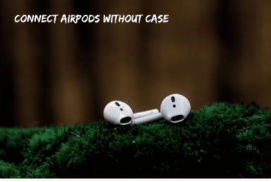 white airpods on a gras