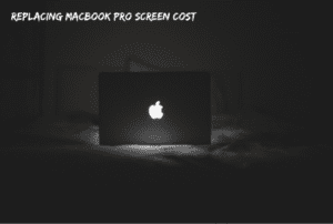 black macbook on bed