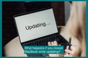 A Macbook with "updating" written on its screen